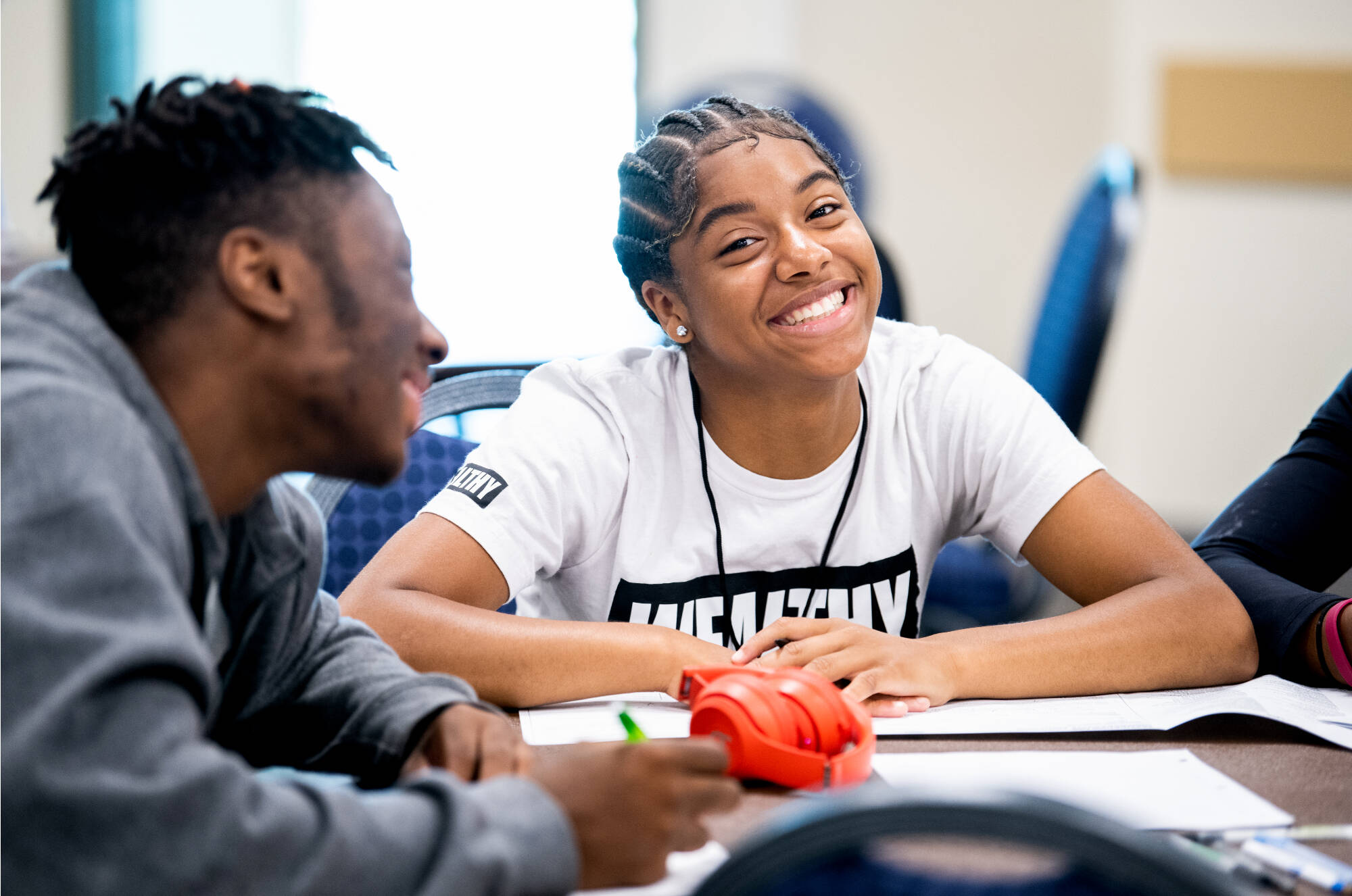 Janie Dickerson, of Detroit, smiles as she works on filling a free GVSU college application during college prep week at Grand Valley State University July 18. The GVSU Charter Schools Office invites junior and senior high school students from GVSU-auth...